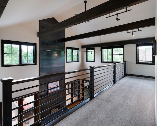 89 W Fieldview St, Bozeman, MT 59715 - corridor with vaulted ceiling, carpet, an upstairs landing, and track lighting