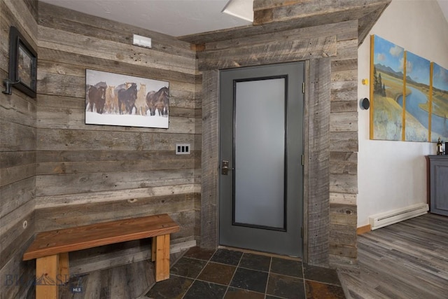 15 Spotted Fawn Ct, Big Sky, MT 59716 - interior space with wood walls, baseboard heating, and dark stone finish floors