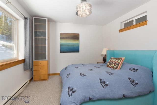 15 Spotted Fawn Ct, Big Sky, MT 59716 - carpeted bedroom featuring a baseboard radiator and baseboards