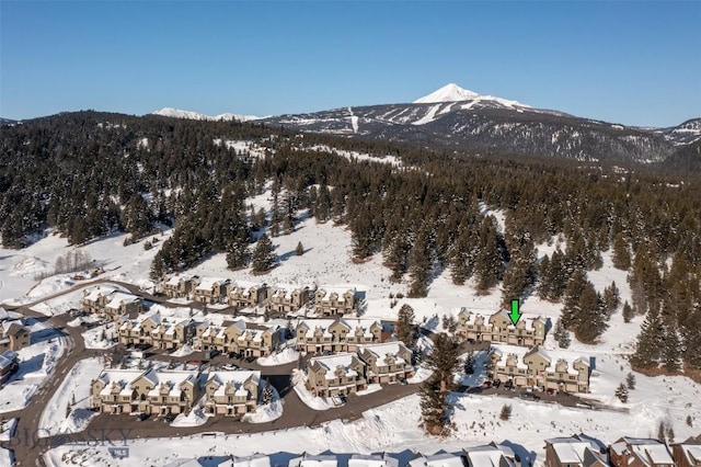 15 Spotted Fawn Ct, Big Sky, MT 59716 - view of mountain background featuring a forest and nearby suburban area