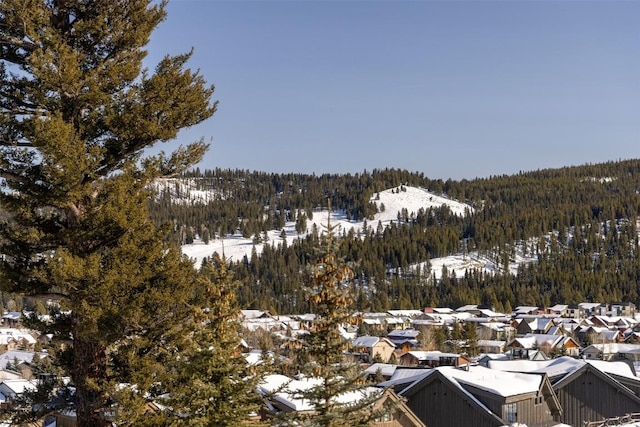 15 Spotted Fawn Ct, Big Sky, MT 59716 - view of mountain backdrop with a forest and nearby suburban area