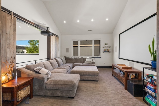 4412 Bembrick St, Bozeman, MT 59718 - carpeted cinema room featuring a barn door, high vaulted ceiling, and recessed lighting