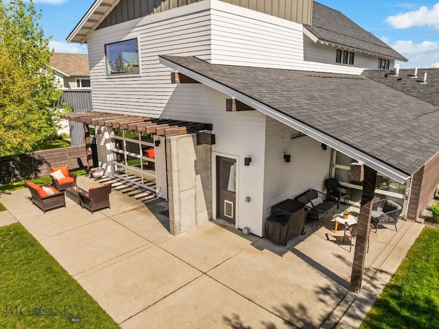 4412 Bembrick St, Bozeman, MT 59718 - back of house featuring outdoor lounge area, roof with shingles, a patio, and board and batten siding