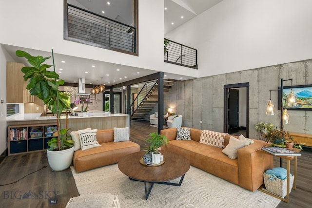4412 Bembrick St, Bozeman, MT 59718 - living area featuring wood finished floors, stairway, a high ceiling, and recessed lighting