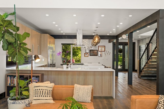 4412 Bembrick St, Bozeman, MT 59718 - kitchen with island exhaust hood, stainless steel fridge, recessed lighting, dark wood-type flooring, and a peninsula