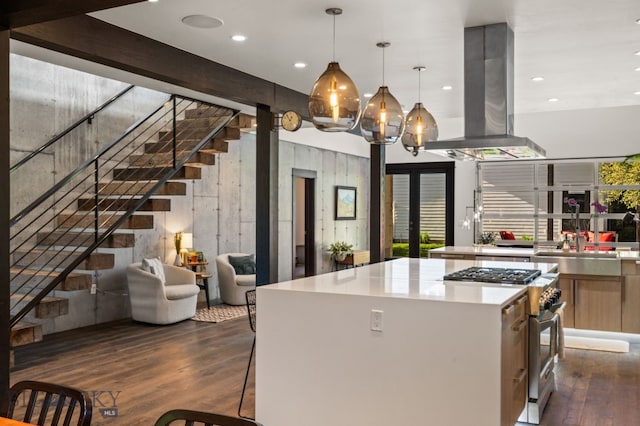 4412 Bembrick St, Bozeman, MT 59718 - kitchen with high end range, island exhaust hood, dark wood-type flooring, light countertops, and a center island