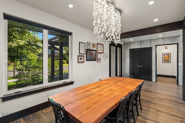 4412 Bembrick St, Bozeman, MT 59718 - dining space with a chandelier, recessed lighting, and wood finished floors