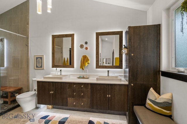 4412 Bembrick St, Bozeman, MT 59718 - full bath featuring double vanity, a tile shower, and vaulted ceiling