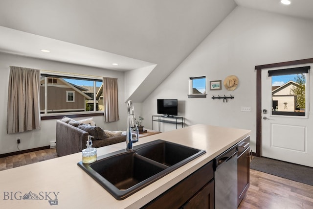 4412 Bembrick St, Bozeman, MT 59718 - kitchen featuring dishwasher, wood finished floors, light countertops, dark brown cabinetry, and recessed lighting