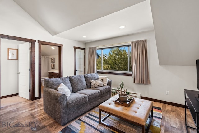 4412 Bembrick St, Bozeman, MT 59718 - living area with vaulted ceiling, light wood finished floors, recessed lighting, and a baseboard heating unit