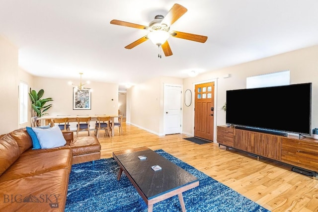 4619 Cascade St, Bozeman, MT 59718 - living area with light wood-style floors, a ceiling fan, and healthy amount of natural light