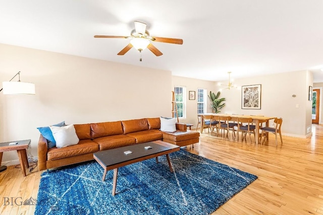4619 Cascade St, Bozeman, MT 59718 - living area featuring light wood-style flooring, ceiling fan, and a chandelier