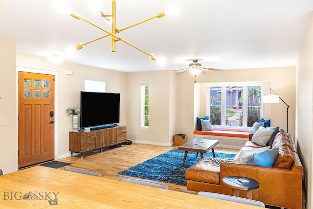 4619 Cascade St, Bozeman, MT 59718 - living area with wood finished floors, a chandelier, and ceiling fan