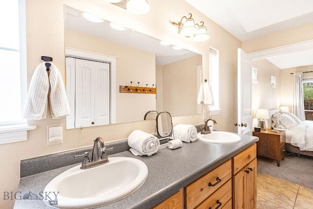 4619 Cascade St, Bozeman, MT 59718 - bathroom featuring ensuite bath, double vanity, and tile patterned floors
