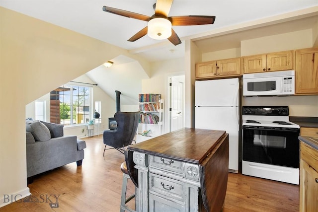 4619 Cascade St, Bozeman, MT 59718 - kitchen with white appliances, open floor plan, light brown cabinetry, light wood-type flooring, and vaulted ceiling