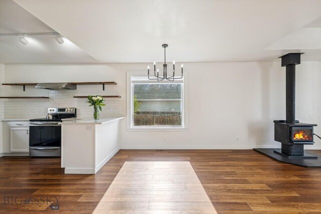 3601 Ravalli St, Bozeman, MT 59718 - kitchen with stainless steel range with electric cooktop, open shelves, light countertops, a chandelier, and dark wood-type flooring
