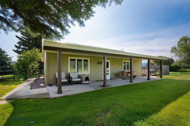 165 N Meadow Creek Rd, Mcallister, MT 59740 - back of house featuring a patio and board and batten siding