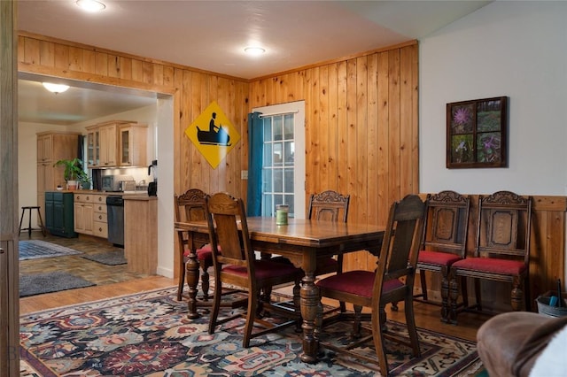 165 N Meadow Creek Rd, Mcallister, MT 59740 - dining space with light wood-type flooring and wooden walls