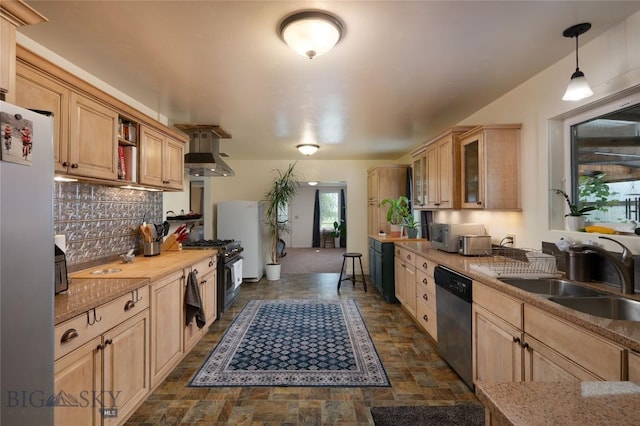 165 N Meadow Creek Rd, Mcallister, MT 59740 - kitchen with stainless steel appliances, wall chimney range hood, decorative backsplash, stone finish floors, and light brown cabinets