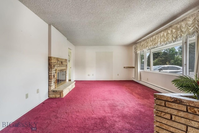 1721 S Willson Ave, Bozeman, MT 59715 - unfurnished living room with carpet flooring, a textured ceiling, a fireplace, and baseboard heating