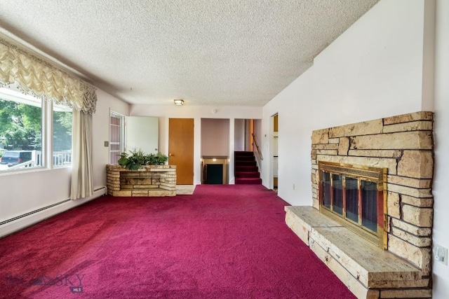 1721 S Willson Ave, Bozeman, MT 59715 - living area featuring a fireplace, a textured ceiling, carpet, stairway, and a baseboard heating unit
