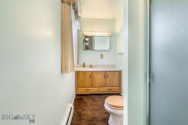 1721 S Willson Ave, Bozeman, MT 59715 - bathroom with vanity and a baseboard heating unit