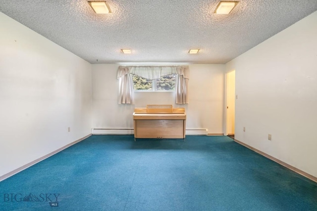 1721 S Willson Ave, Bozeman, MT 59715 - carpeted empty room with a baseboard heating unit, a baseboard radiator, and a textured ceiling