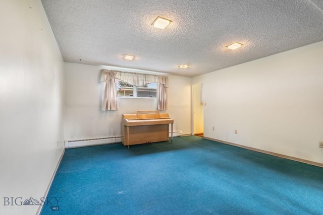 1721 S Willson Ave, Bozeman, MT 59715 - carpeted empty room with a baseboard heating unit and a textured ceiling