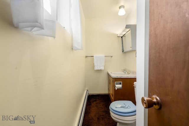 1721 S Willson Ave, Bozeman, MT 59715 - half bathroom with vanity and baseboard heating