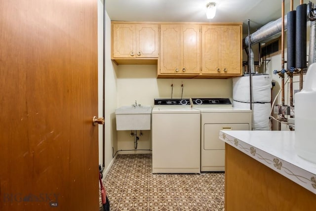 1721 S Willson Ave, Bozeman, MT 59715 - laundry room featuring washer and dryer, cabinet space, and water heater