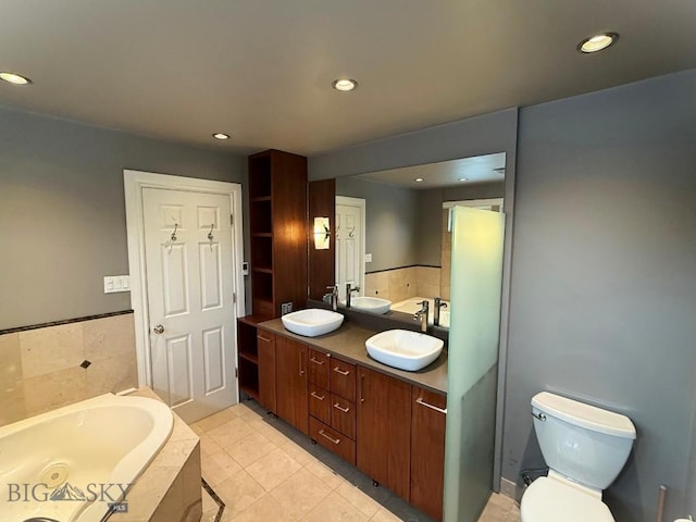 1416 W Gold St, Butte, MT 59701 - bathroom with a garden tub, double vanity, recessed lighting, and tile patterned floors