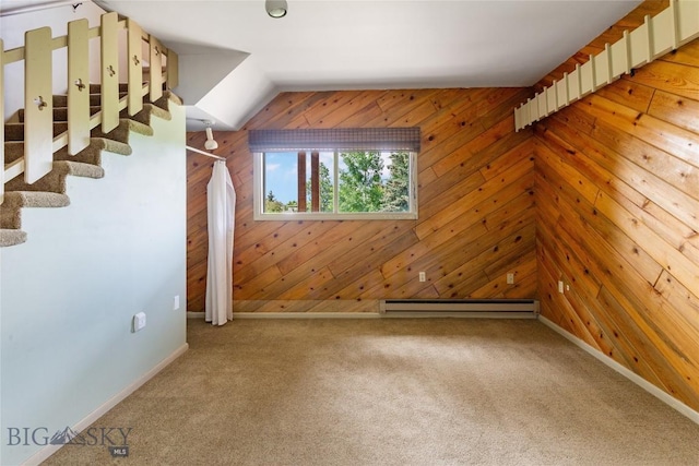 1416 W Gold St, Butte, MT 59701 - unfurnished room featuring baseboard heating, wooden walls, light colored carpet, and vaulted ceiling