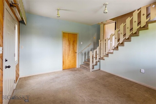 1416 W Gold St, Butte, MT 59701 - empty room with carpet floors and stairway