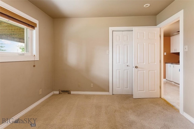 1416 W Gold St, Butte, MT 59701 - unfurnished bedroom featuring carpet floors and a closet