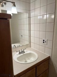21 Sitting Bull Rd Unit 1233, Big Sky, MT 59716 - bathroom featuring vanity and tile walls