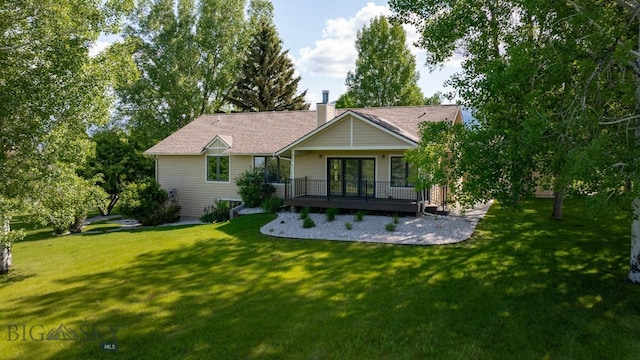4901 Itana Cir, Bozeman, MT 59715 - rear view of property featuring a deck, a yard, and a chimney