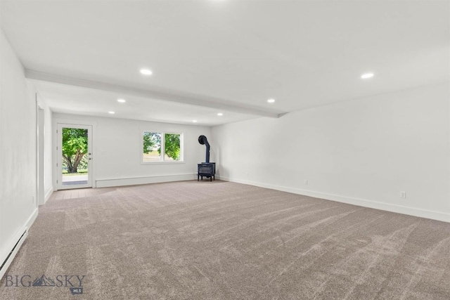 4901 Itana Cir, Bozeman, MT 59715 - carpeted spare room featuring a wood stove, recessed lighting, a baseboard radiator, and beamed ceiling