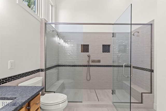 4901 Itana Cir, Bozeman, MT 59715 - full bathroom with vanity, a shower stall, tile walls, and tile patterned flooring