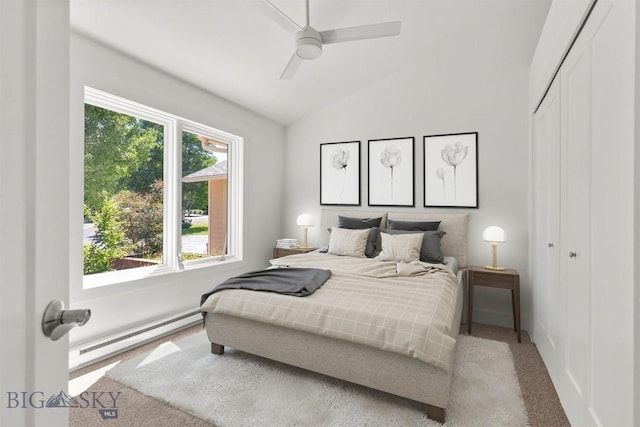 4901 Itana Cir, Bozeman, MT 59715 - bedroom with carpet floors, a baseboard radiator, vaulted ceiling, a closet, and ceiling fan