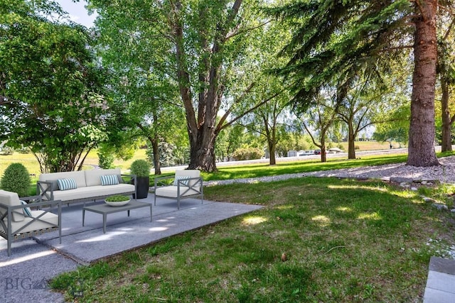 4901 Itana Cir, Bozeman, MT 59715 - view of grassy yard featuring an outdoor living space and a patio