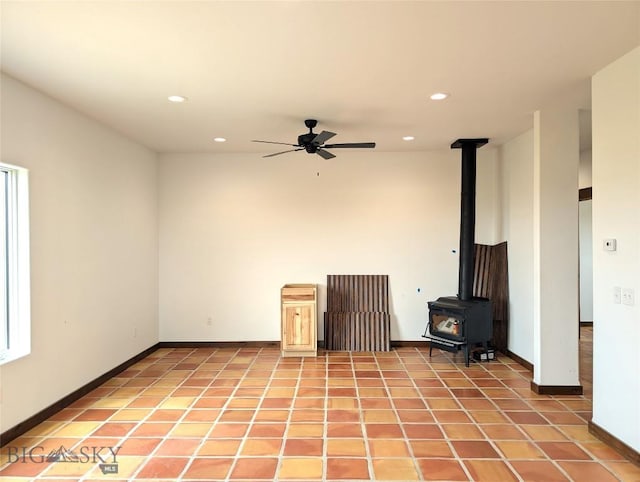 51 Highlander Dr, Three Forks, MT 59752 - empty room featuring a wood stove, a ceiling fan, and recessed lighting