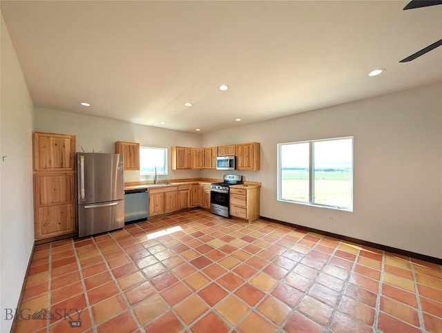 51 Highlander Dr, Three Forks, MT 59752 - kitchen with appliances with stainless steel finishes, plenty of natural light, recessed lighting, light countertops, and light tile patterned flooring