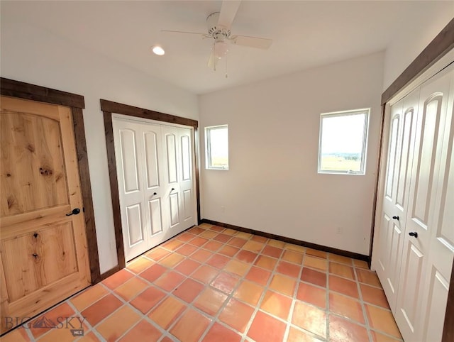 51 Highlander Dr, Three Forks, MT 59752 - unfurnished bedroom with multiple windows, a closet, recessed lighting, ceiling fan, and light tile patterned floors