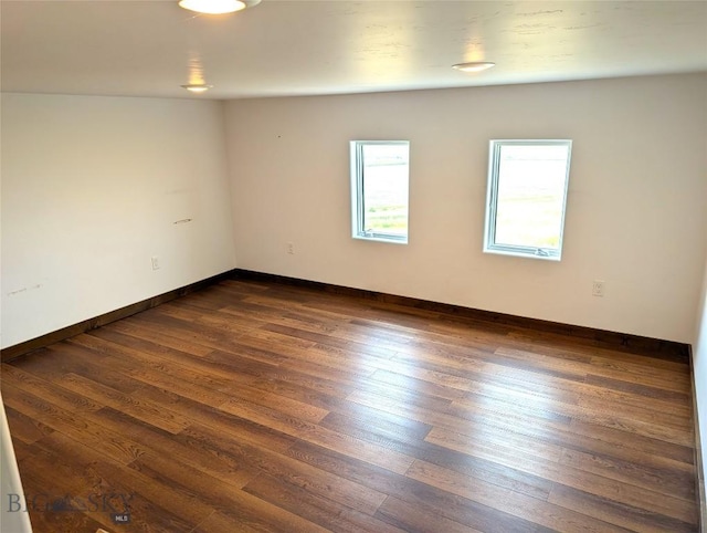 51 Highlander Dr, Three Forks, MT 59752 - empty room featuring dark wood-type flooring and baseboards