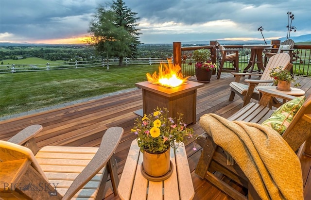 390 Hayrake Ln, Bozeman, MT 59715 - deck at dusk featuring an outdoor fire pit