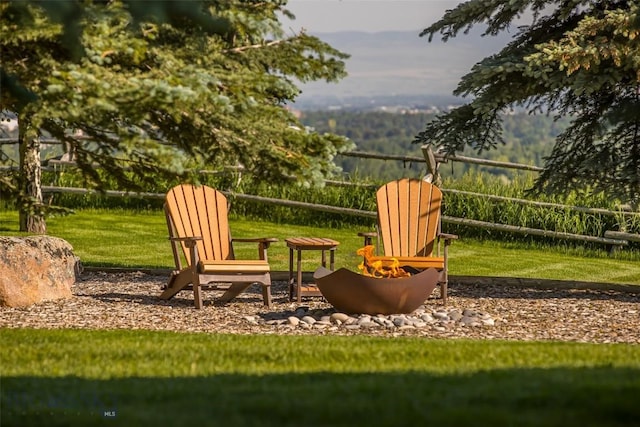 390 Hayrake Ln, Bozeman, MT 59715 - view of grassy yard featuring an outdoor fire pit