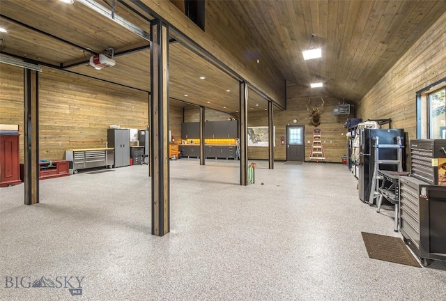 390 Hayrake Ln, Bozeman, MT 59715 - garage featuring wood walls and a garage door opener