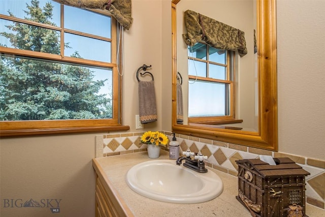 390 Hayrake Ln, Bozeman, MT 59715 - bathroom with vanity and tasteful backsplash