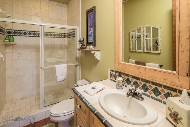 390 Hayrake Ln, Bozeman, MT 59715 - bathroom with vanity, a stall shower, and backsplash