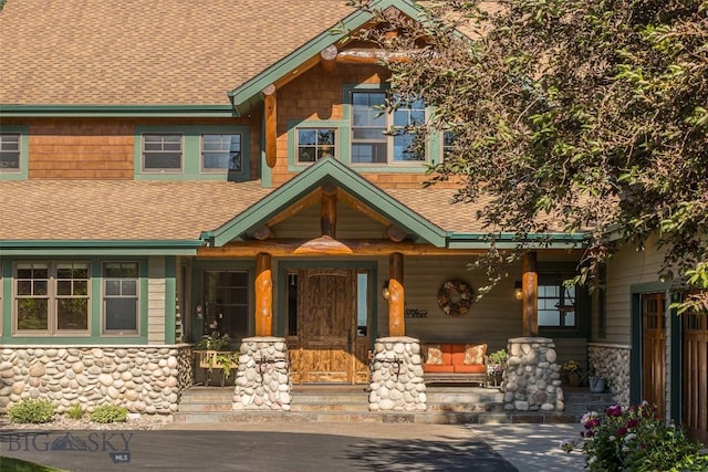 390 Hayrake Ln, Bozeman, MT 59715 - view of front of home featuring a shingled roof and covered porch